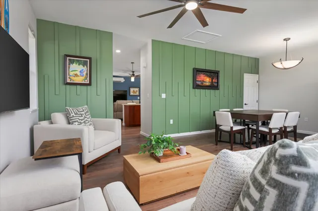 a living room with furniture and a flat screen tv