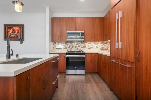 a living room with furniture a ceiling fan and a rug