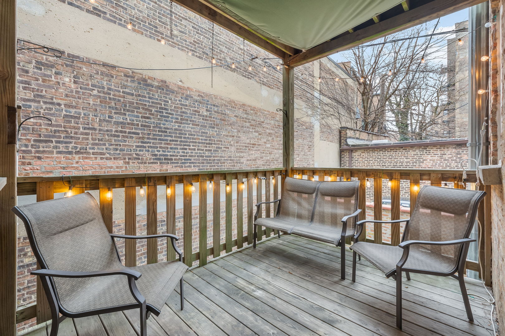 629 West Sheridan Road, Unit 1D Chicago, IL 60613 - Photo 14 of 17 a balcony with chairs and with outdoor views