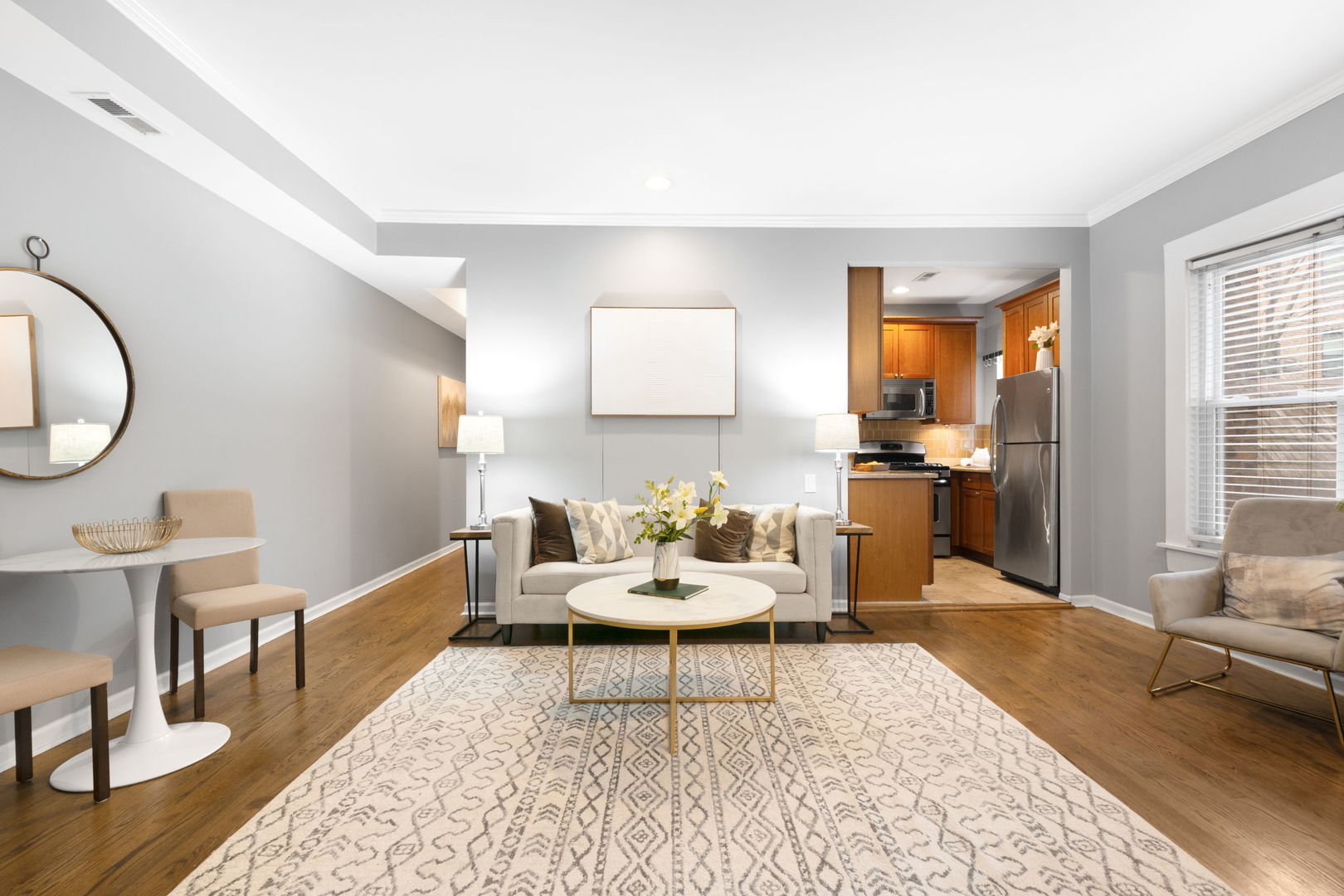629 West Sheridan Road, Unit 1D Chicago, IL 60613 - Photo 3 of 17 a living room with furniture and a wooden floor