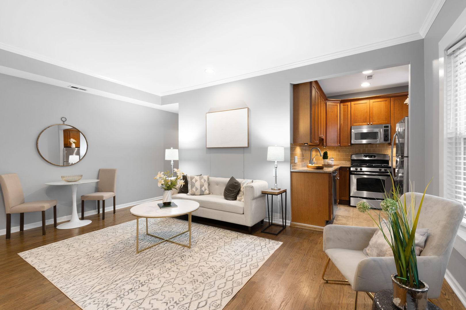629 West Sheridan Road, Unit 1D Chicago, IL 60613 - Photo 5 of 17 a living room with furniture and a wooden floor