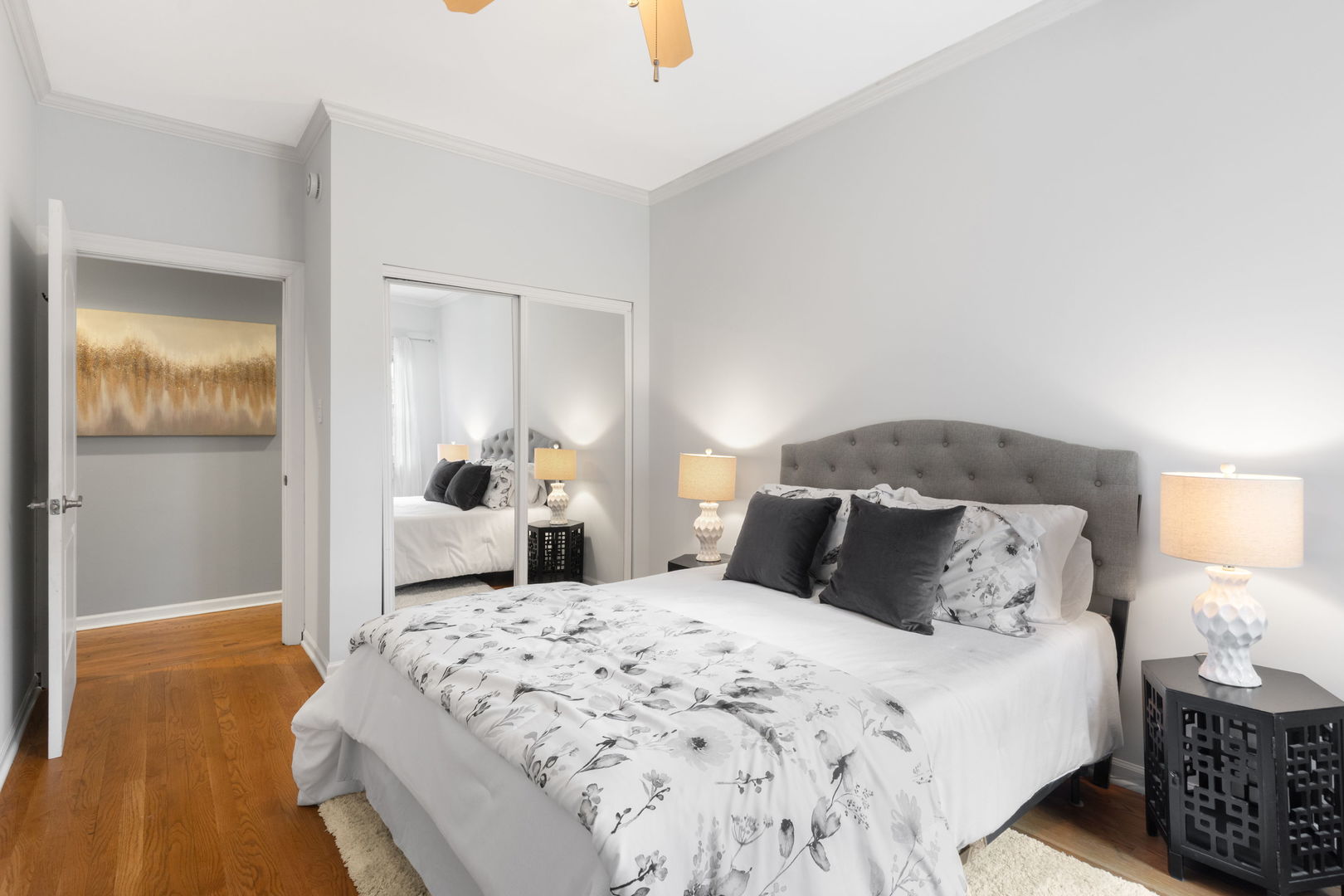 629 West Sheridan Road, Unit 1D Chicago, IL 60613 - Photo 9 of 17 a bedroom with a bed and wooden floor