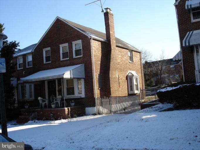1901 Ramblewood Road Baltimore, MD 21239 - Photo 3 of 7 a front view of a house with garden