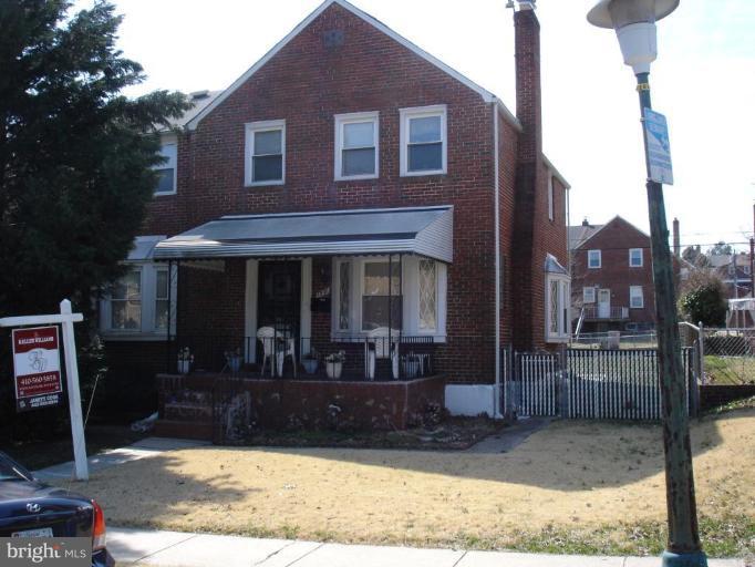 1901 Ramblewood Road Baltimore, MD 21239 - Photo 7 of 7 a front view of a house with garden