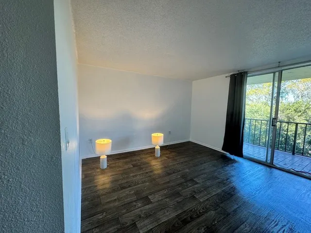 a bedroom with a bed and a potted plant