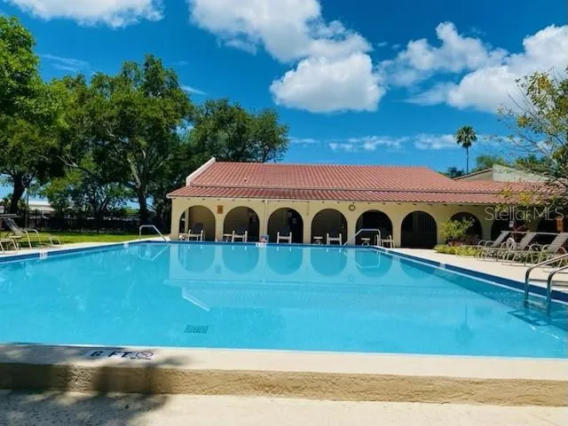 a view of swimming pool with a garden