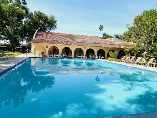 a bathroom with a toilet a sink and shower