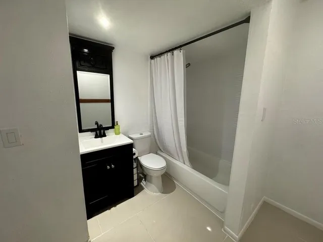 a view of empty room with stairs