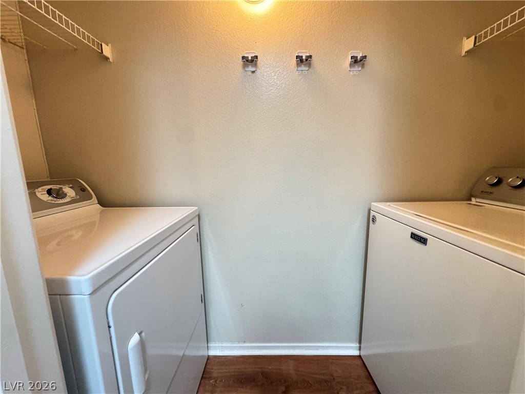 7255 West Sunset Road, Unit 2111 Las Vegas, NV 89113 - Photo 21 of 33 Functional laundry nook includes washer, dryer, and overhead storage.