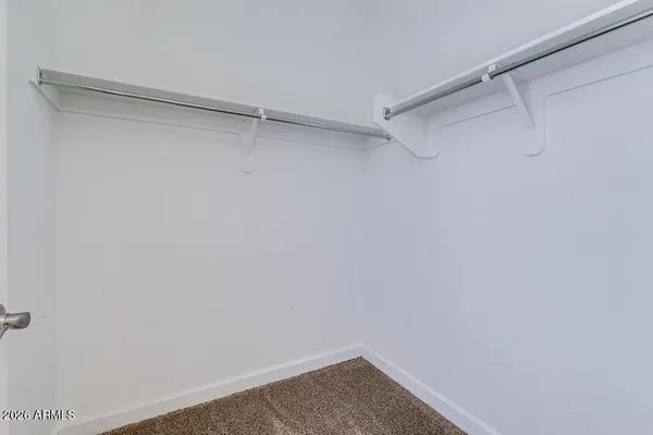 a view of a room with shelf on the wall