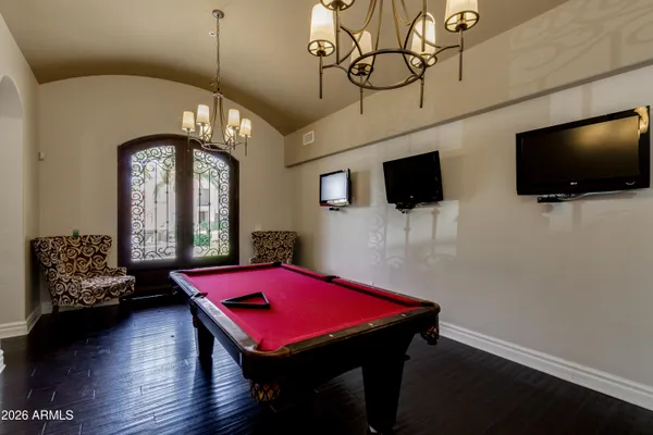 a view of a livingroom with furniture and a flat screen tv
