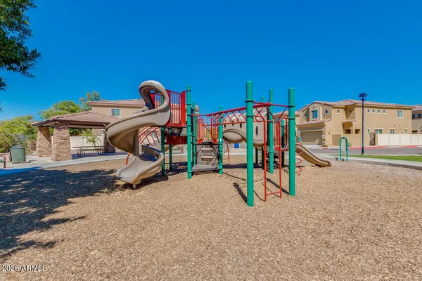 a view of outdoor space with seating area and slide