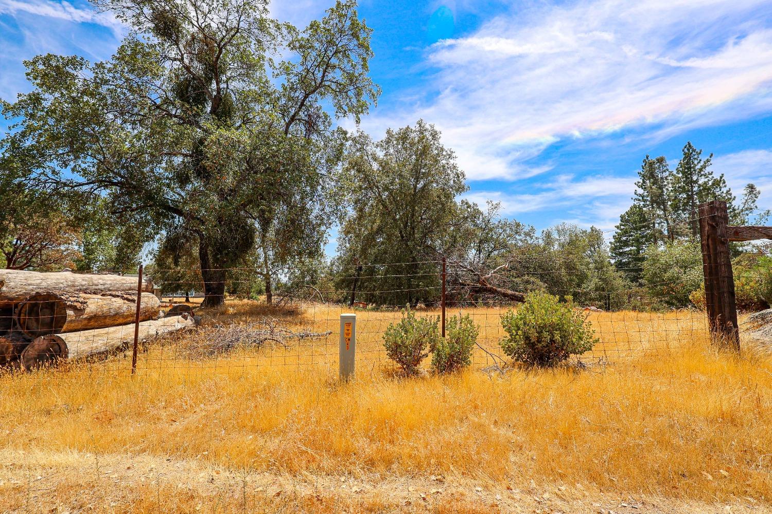 5240 Tiptop Road Mariposa, CA 95338 - Photo 69 of 71 a view of a swimming pool with an outdoor seating and yard