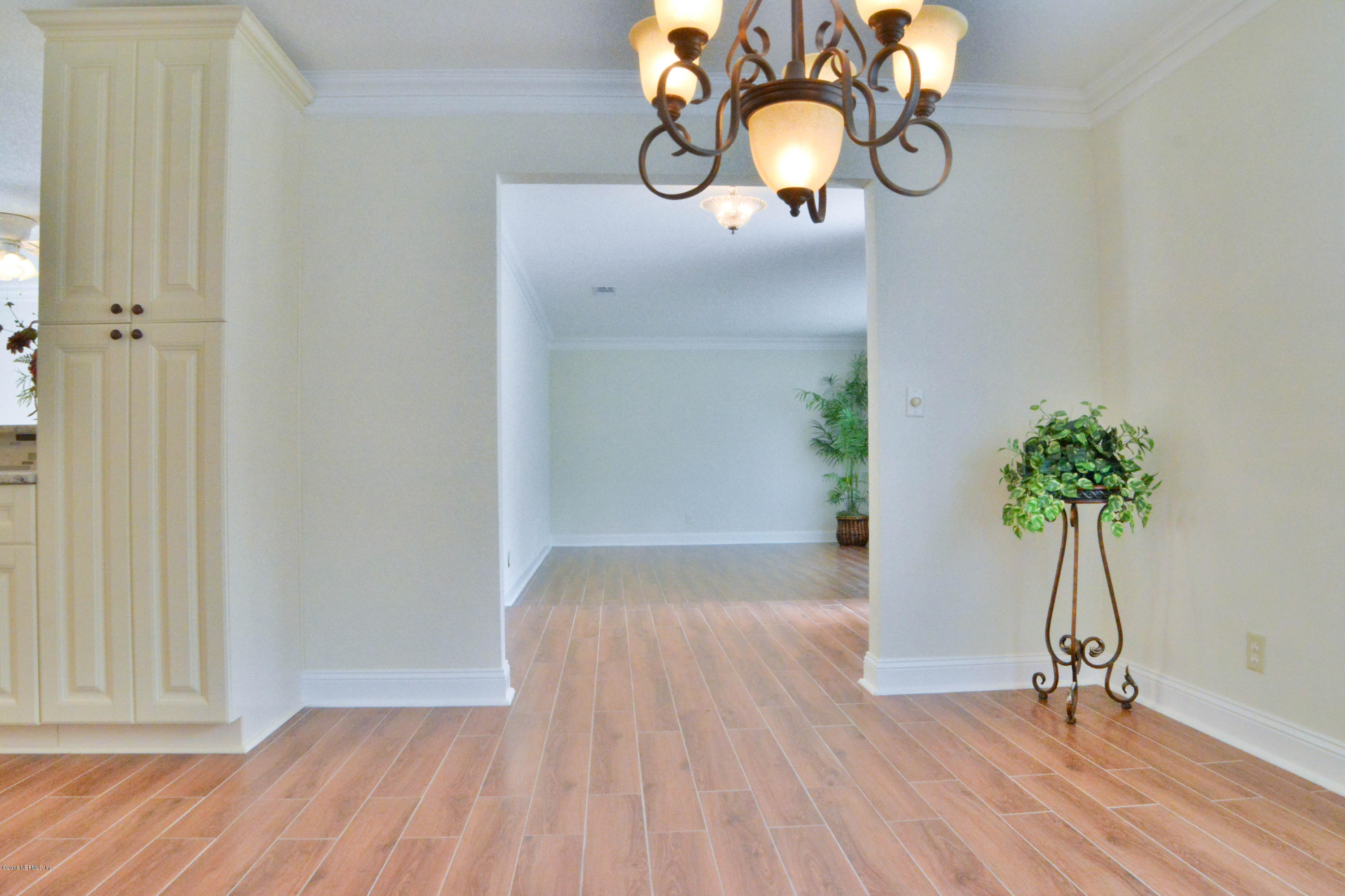 6717 West Fincannon Road Jacksonville, FL 32277 - Photo 14 of 32 a view of empty room with wooden floor