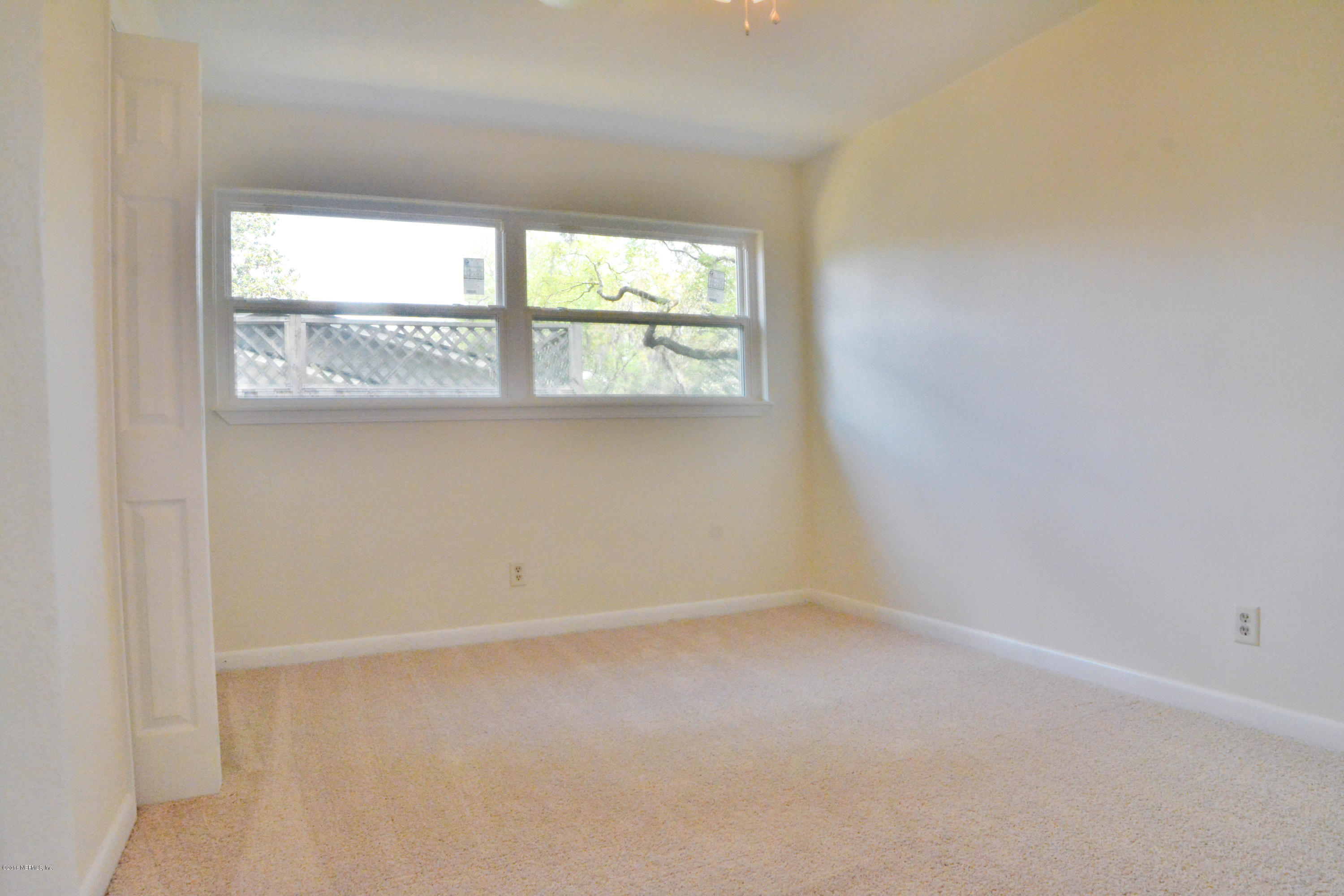 6717 West Fincannon Road Jacksonville, FL 32277 - Photo 15 of 32 an empty room with a window
