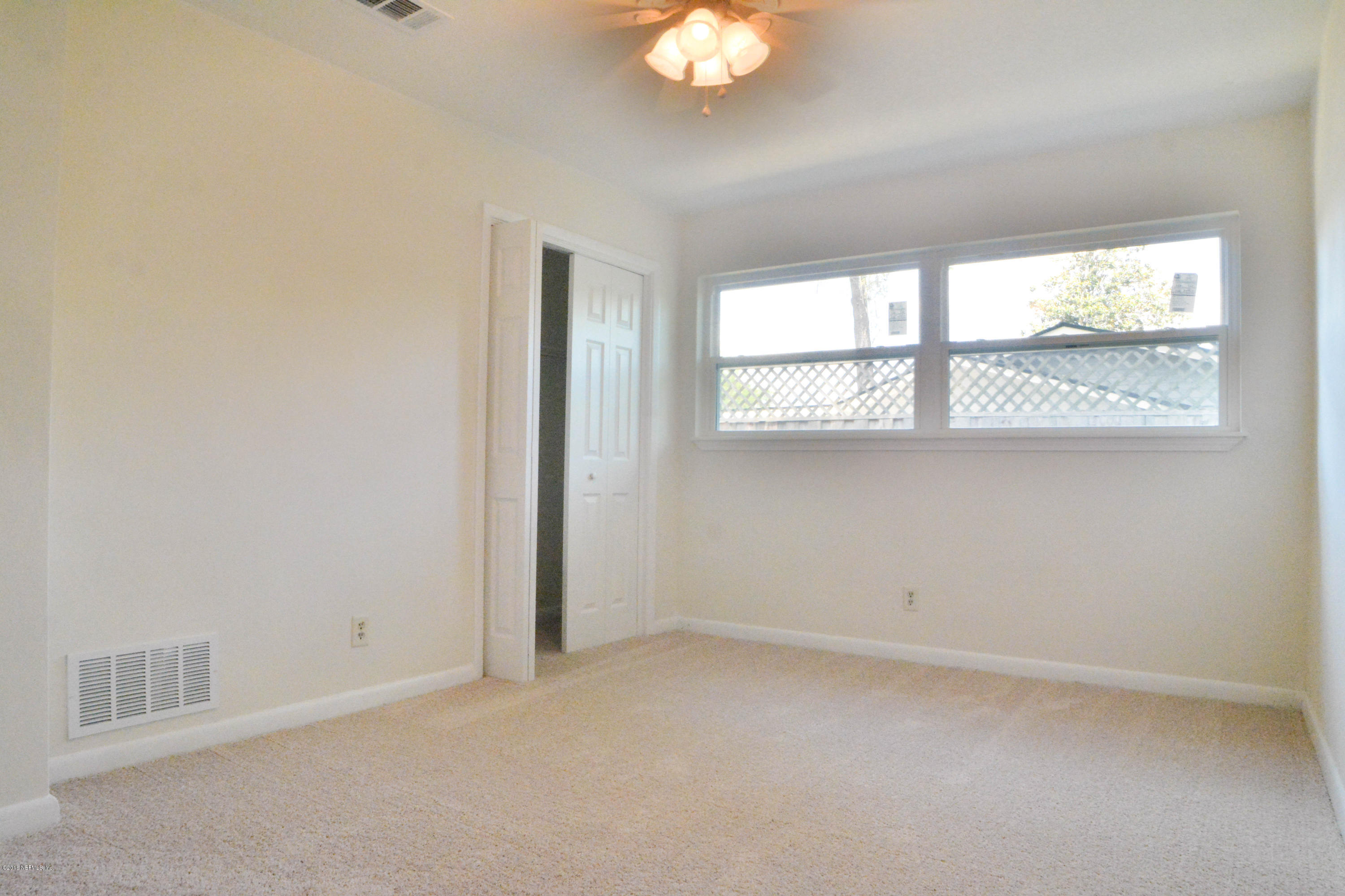 6717 West Fincannon Road Jacksonville, FL 32277 - Photo 16 of 32 an empty room with a window