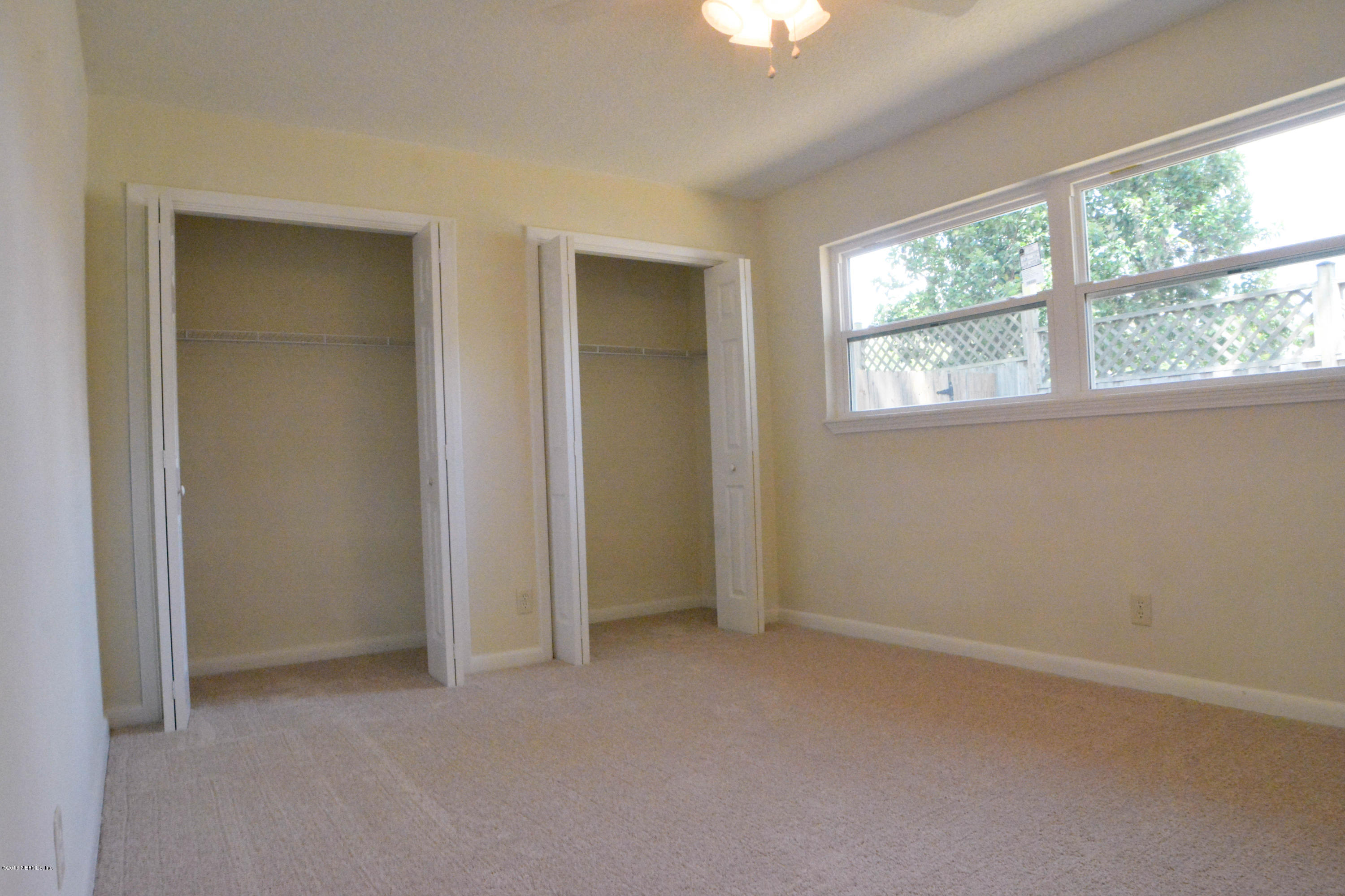 6717 West Fincannon Road Jacksonville, FL 32277 - Photo 21 of 32 an empty room that has a window