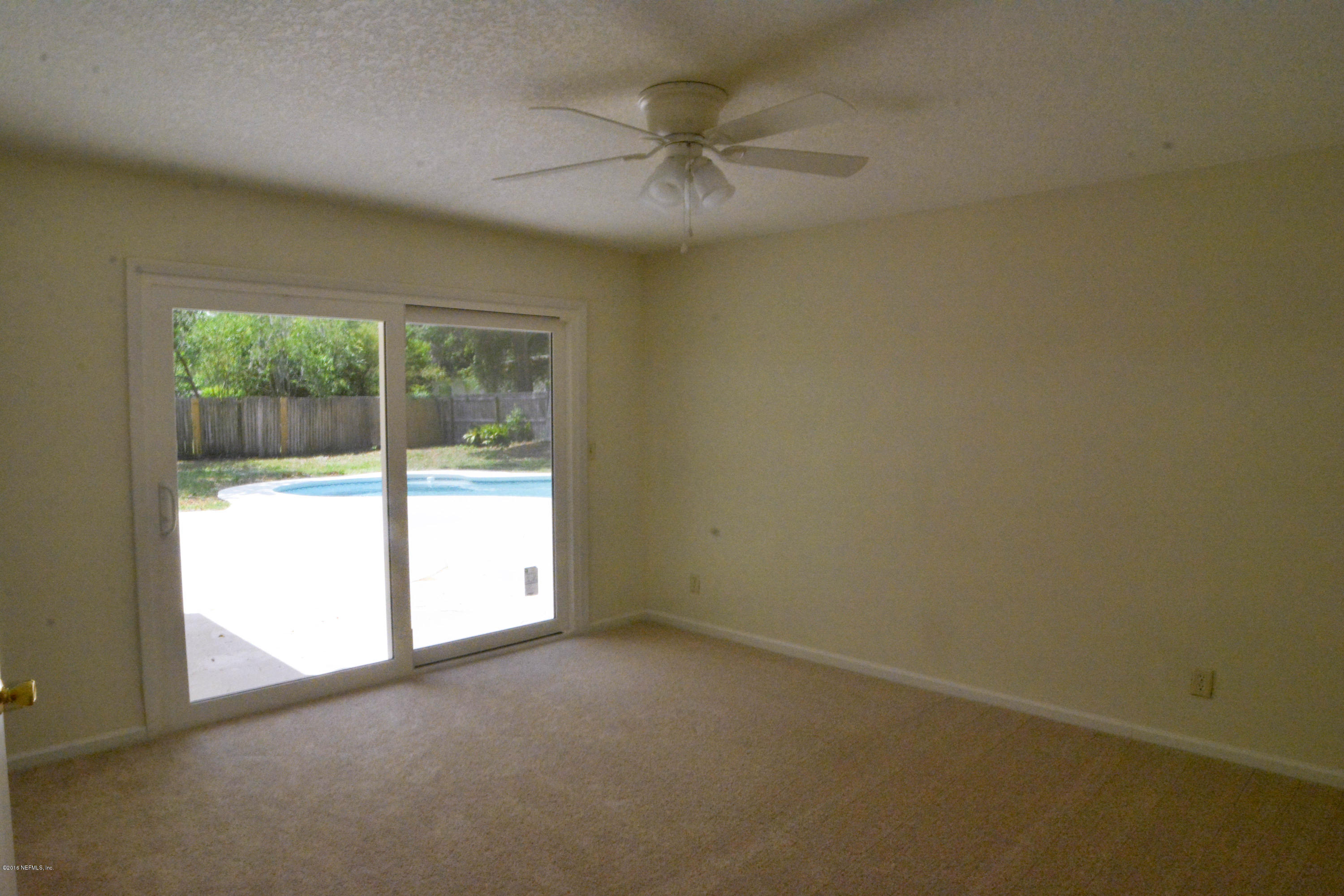 6717 West Fincannon Road Jacksonville, FL 32277 - Photo 22 of 32 an empty room with a window