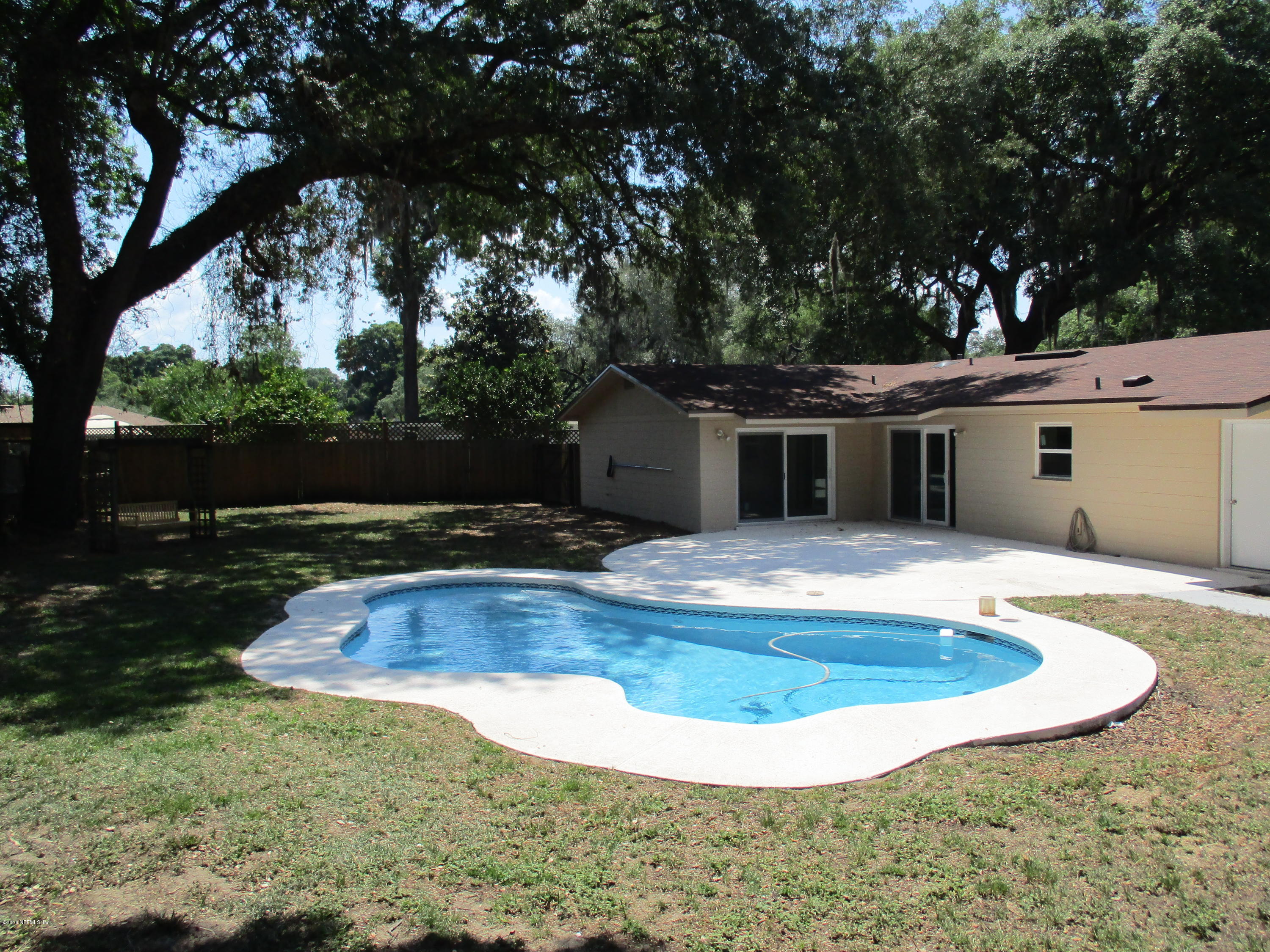 6717 West Fincannon Road Jacksonville, FL 32277 - Photo 26 of 32 a view of a house with swimming pool