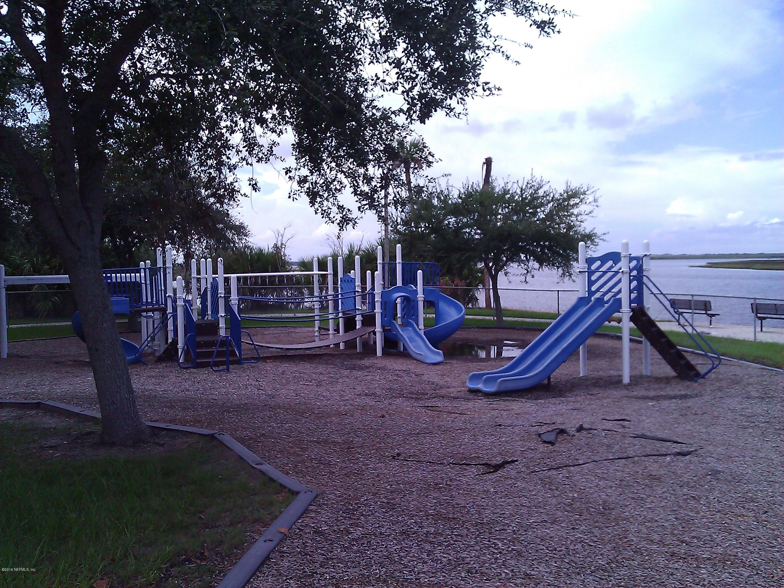 6717 West Fincannon Road Jacksonville, FL 32277 - Photo 32 of 32 a view of outdoor space with playground and green space