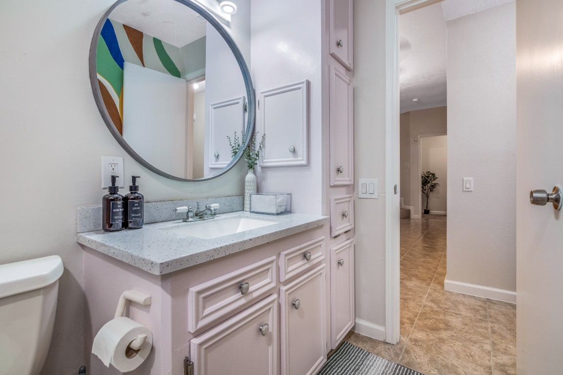 2539 Jester Lane Stafford, TX 77477 - Photo 15 of 16 a bathroom with a sink a vanity and a mirror