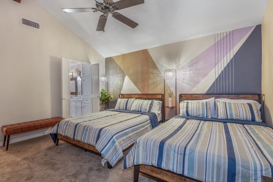 2539 Jester Lane Stafford, TX 77477 - Photo 16 of 16 a bedroom with two beds and a chandelier