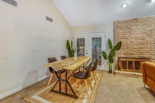 a view of a dining room with furniture and window