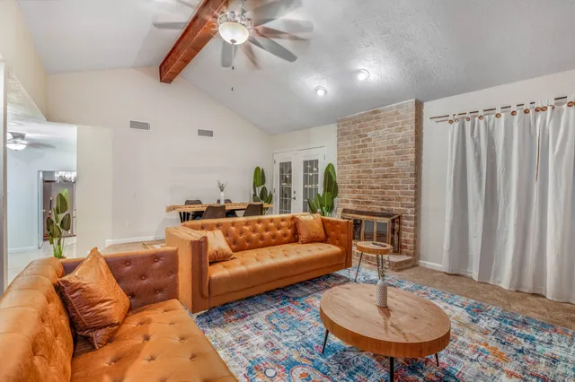 a living room with furniture and a breakfast area