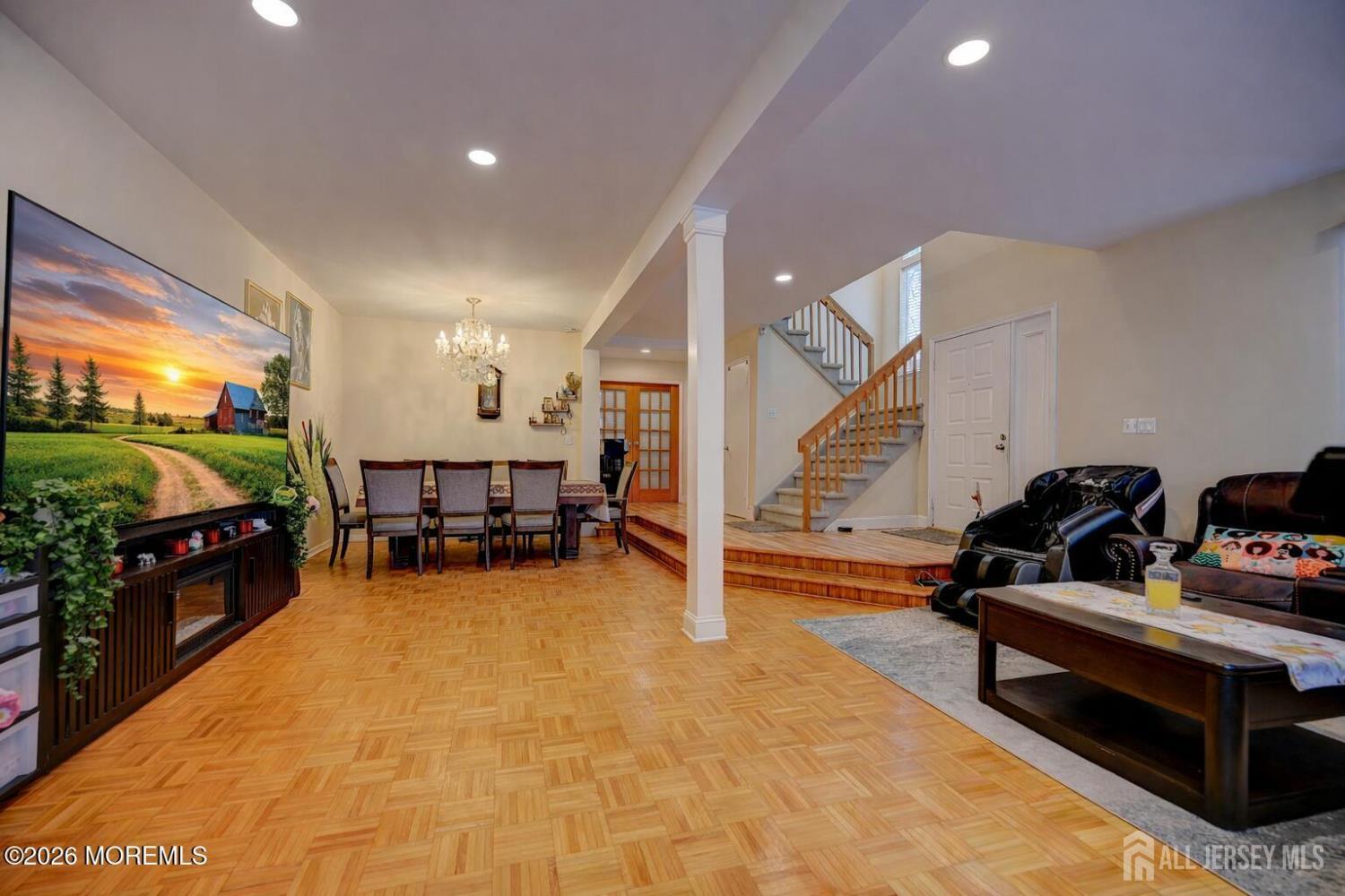 22 Borell Square Parlin, NJ 08859 - Photo 8 of 32 a living room with furniture and a flat screen tv