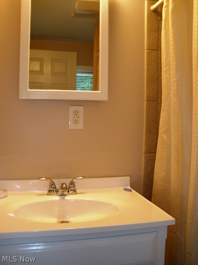 8174 Maddock Road North Ridgeville, OH 44039 - Photo 12 of 16 The full bath has been completely remodeled and includes a ceramic tile shower, new vanity and marble flooring