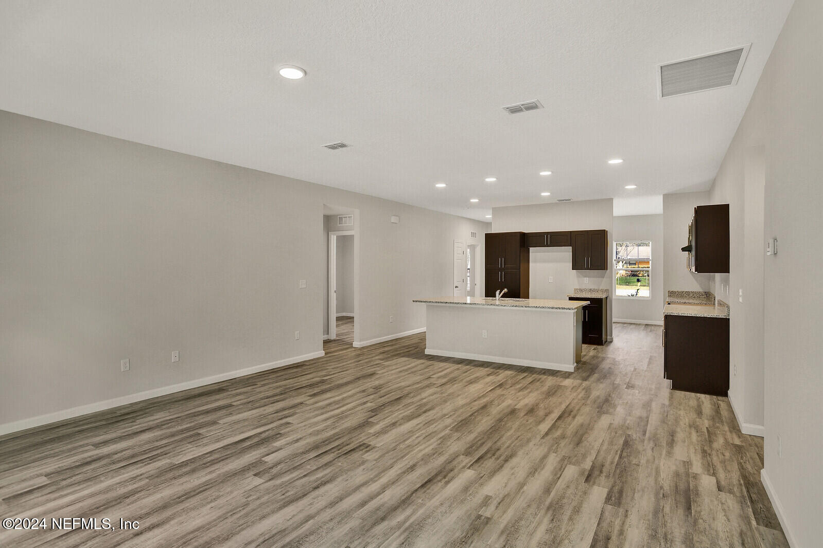 7267 Honda Drive Jacksonville, FL 32222 - Photo 9 of 26 Kitchen Overlooking Living Area