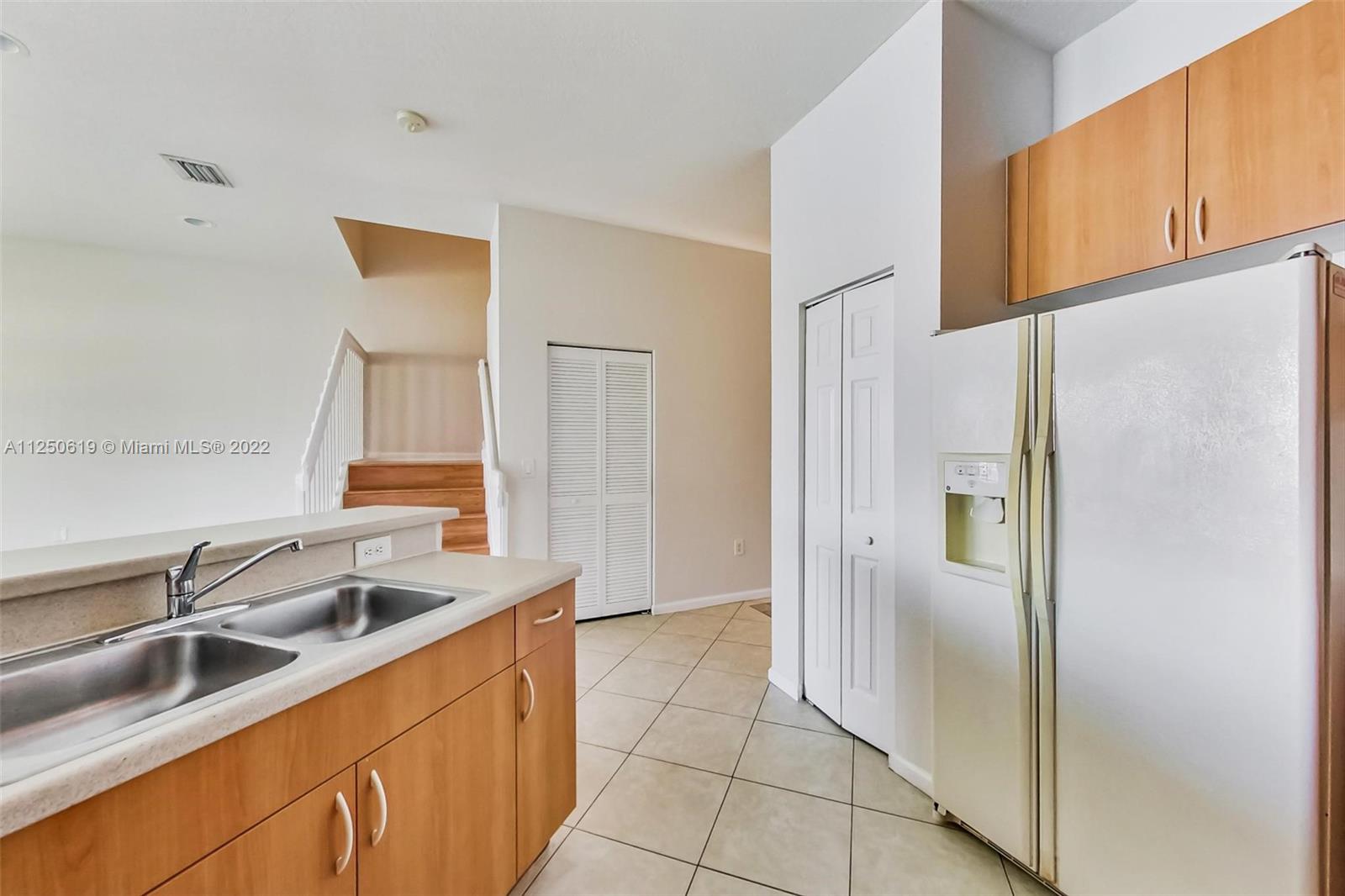Silver Falls Miramar, FL 33027 - Photo 12 of 38 a kitchen with stainless steel appliances granite countertop a refrigerator and a sink