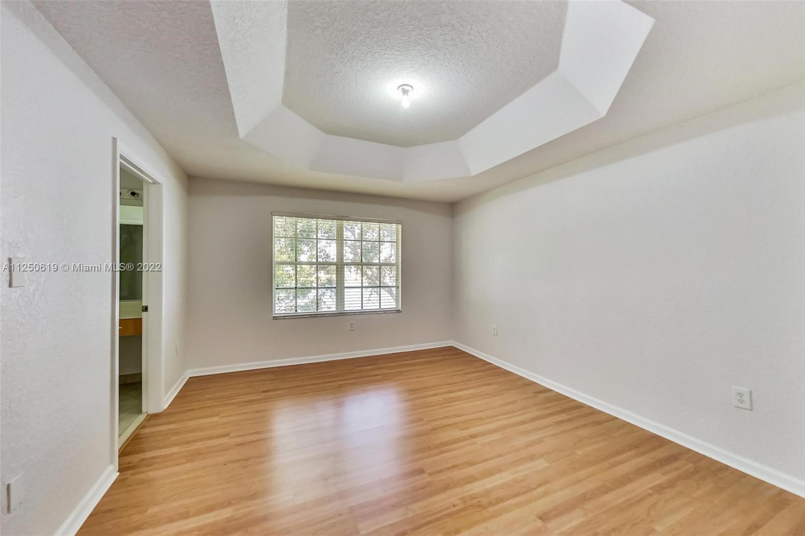 Silver Falls Miramar, FL 33027 - Photo 14 of 38 wooden floor in an empty room with a window