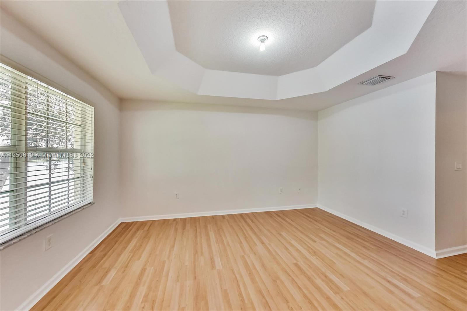 Silver Falls Miramar, FL 33027 - Photo 15 of 38 wooden floor in an empty room with a window