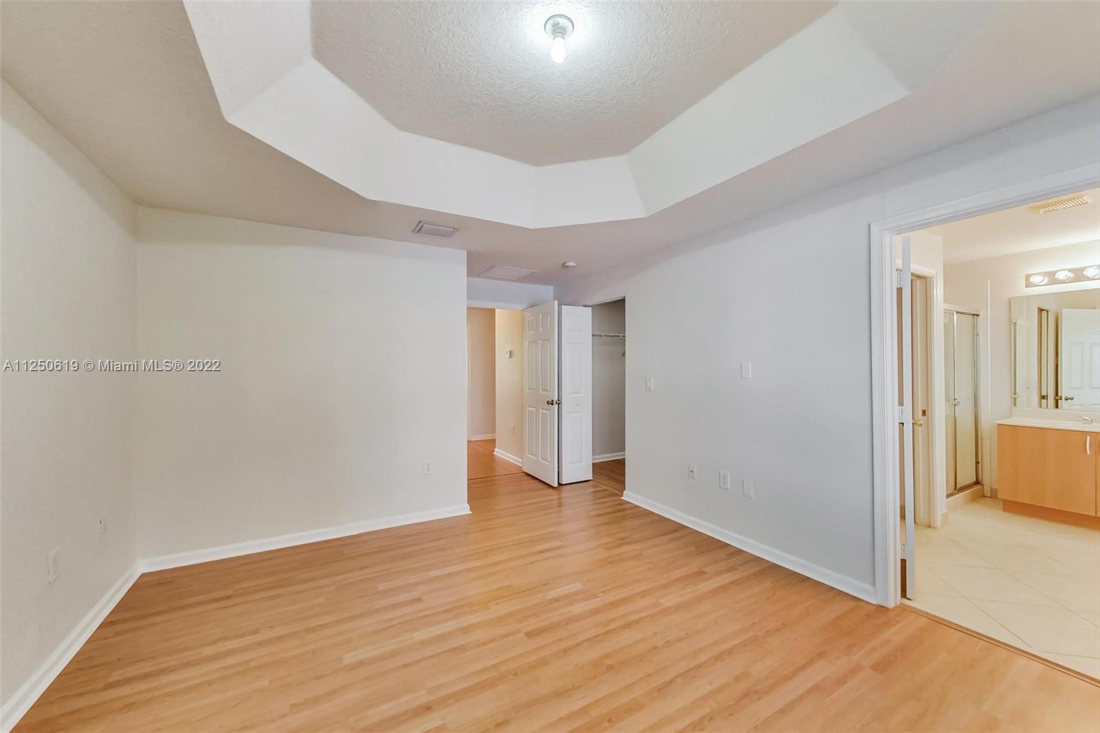 Silver Falls Miramar, FL 33027 - Photo 16 of 38 a view of an empty room with wooden floor