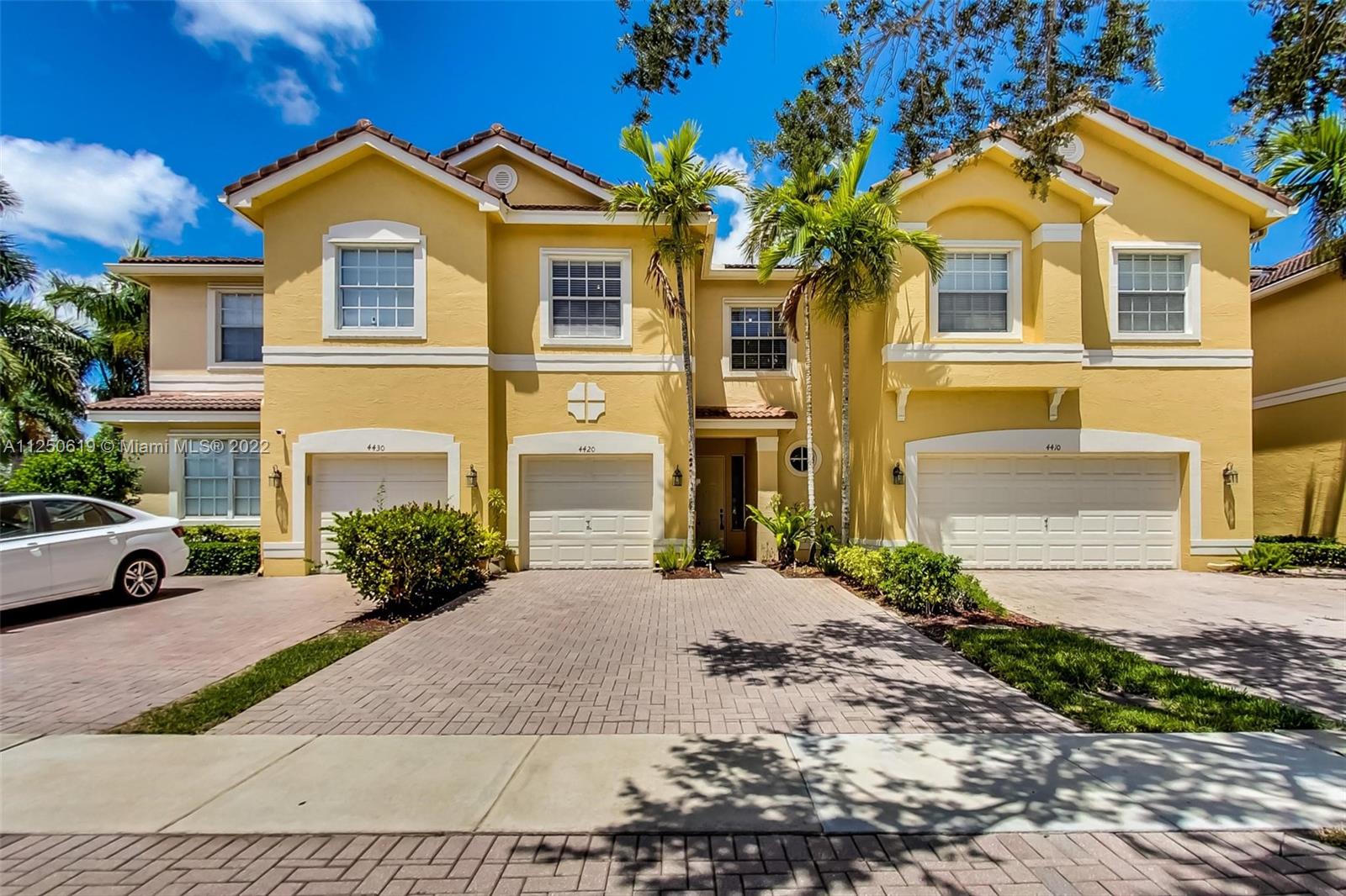 Silver Falls Miramar, FL 33027 - Photo 2 of 38 a front view of a house with a yard and garage