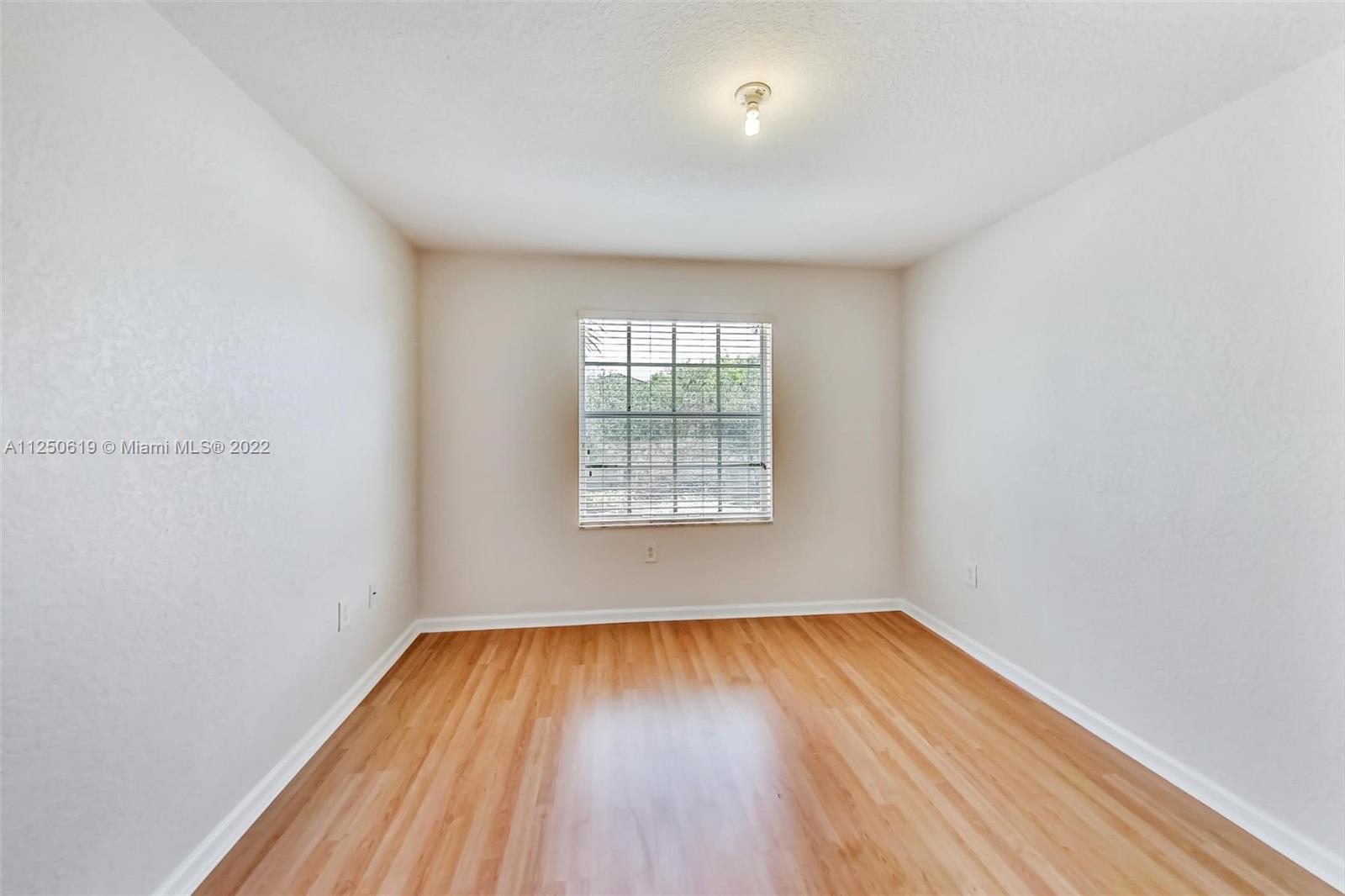 Silver Falls Miramar, FL 33027 - Photo 23 of 38 a view of empty room with wooden floor and fan