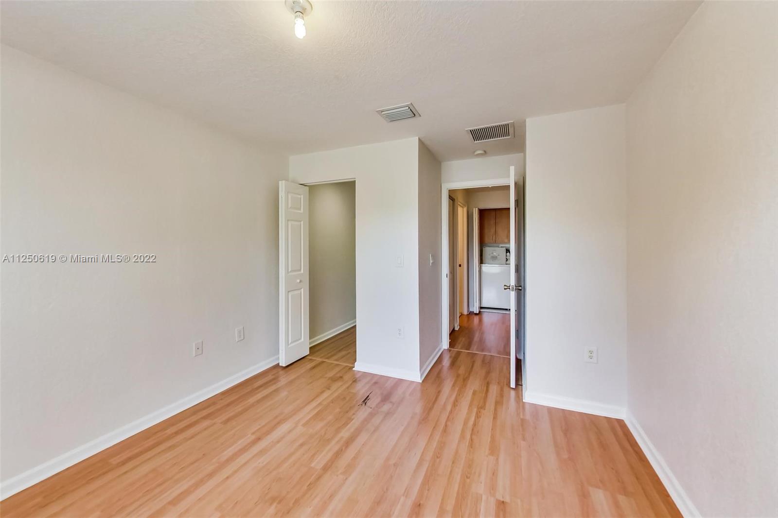 Silver Falls Miramar, FL 33027 - Photo 24 of 38 a view of hallway with wooden floor