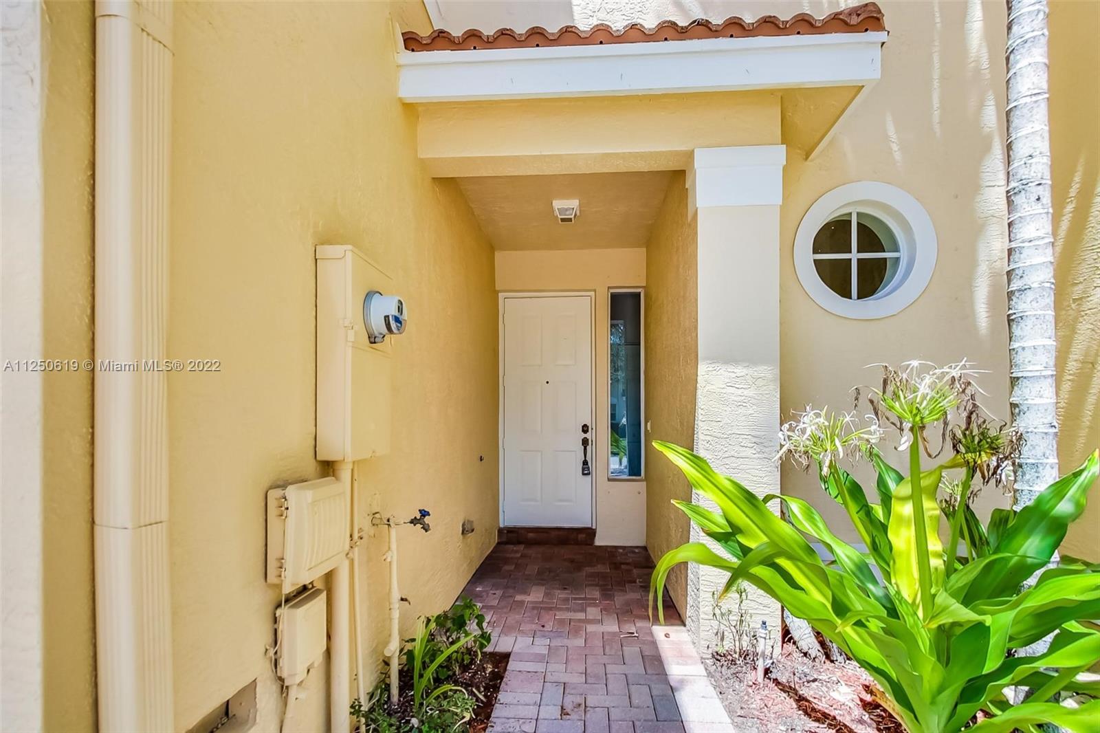 Silver Falls Miramar, FL 33027 - Photo 3 of 38 a front view of a house with a yard
