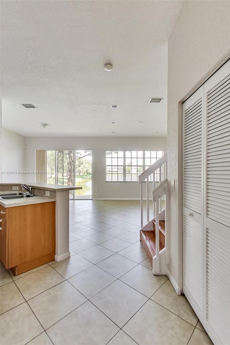 Silver Falls Miramar, FL 33027 - Photo 5 of 38 a view of empty room with wooden floor and fireplace