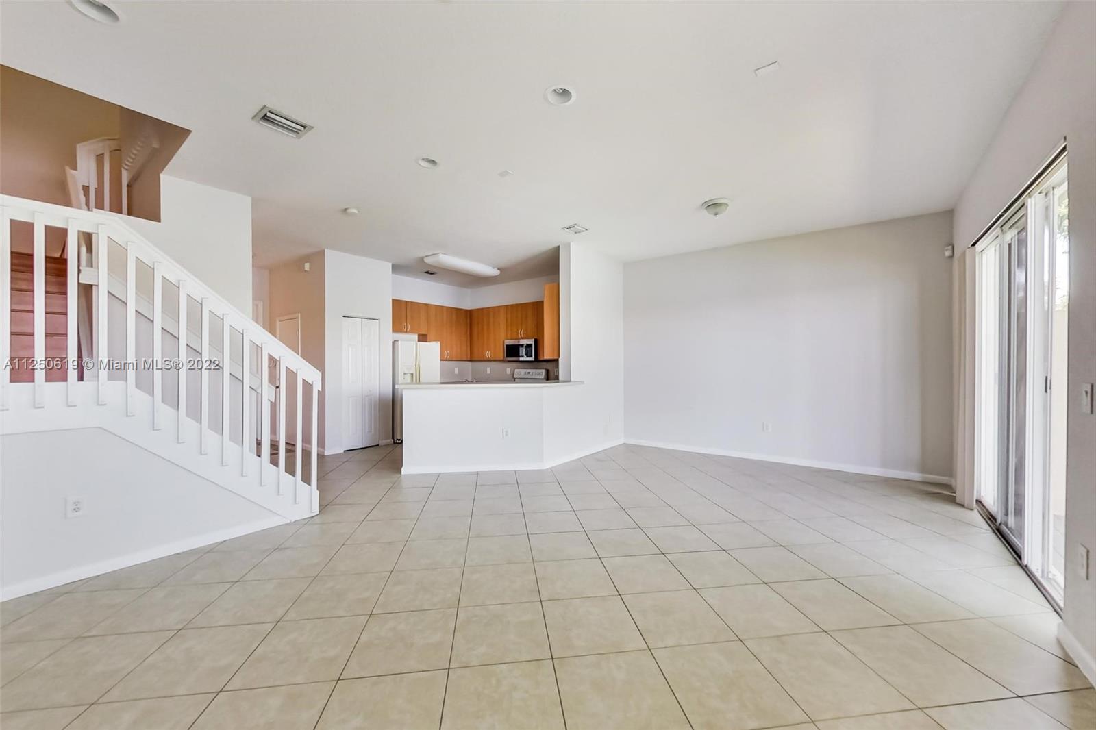 Silver Falls Miramar, FL 33027 - Photo 7 of 38 a view of an entryway with stairs and a window