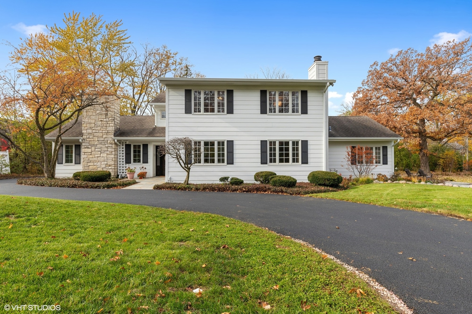 1414 North Avenue Bannockburn, IL 60015 - Photo 1 of 29 a front view of a house with a yard and garage