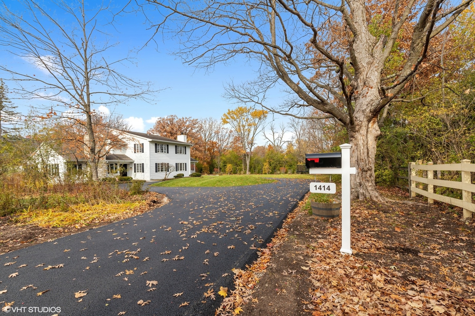 1414 North Avenue Bannockburn, IL 60015 - Photo 2 of 29 a view of a street with large trees