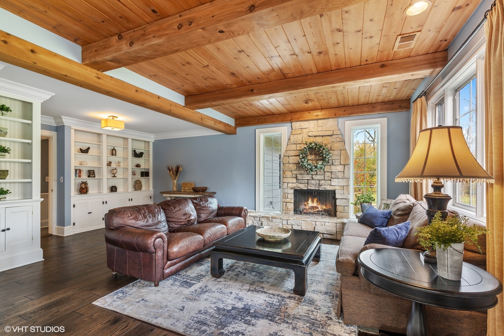 1414 North Avenue Bannockburn, IL 60015 - Photo 11 of 29 a living room with furniture a fireplace and a table