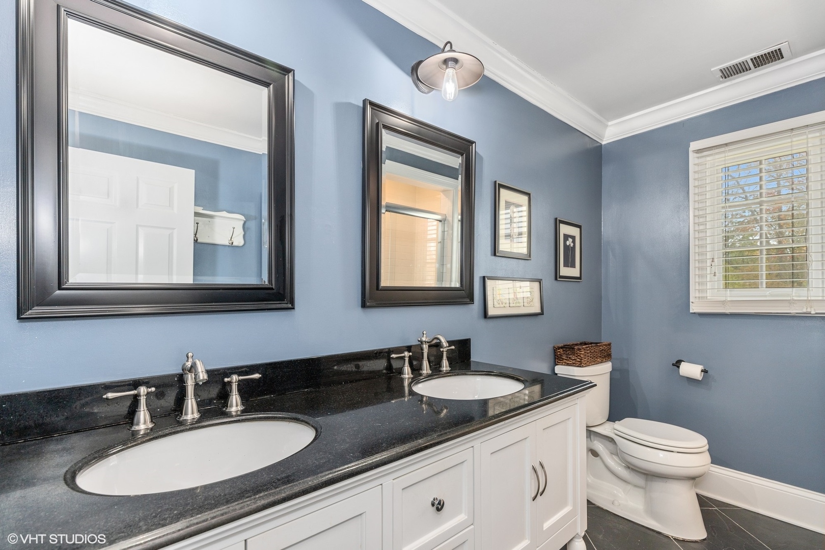 1414 North Avenue Bannockburn, IL 60015 - Photo 16 of 29 a bathroom with double sink and a mirror