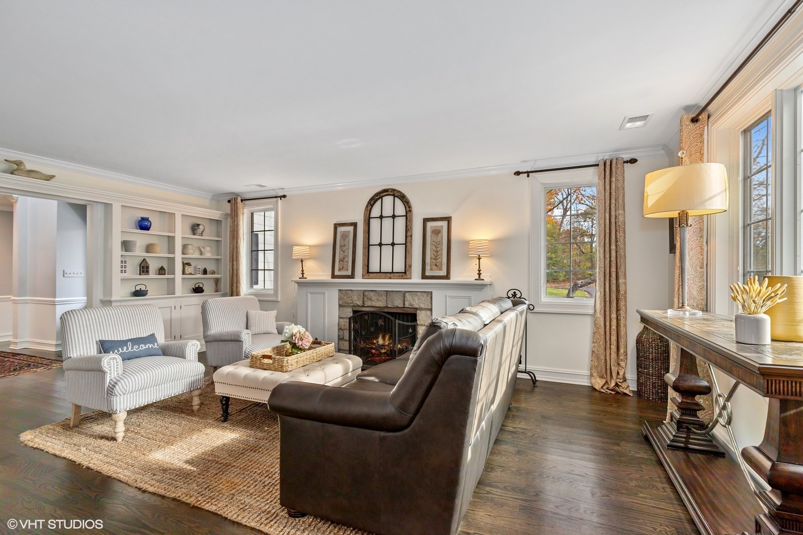 1414 North Avenue Bannockburn, IL 60015 - Photo 6 of 29 a living room with furniture a fireplace and a large window