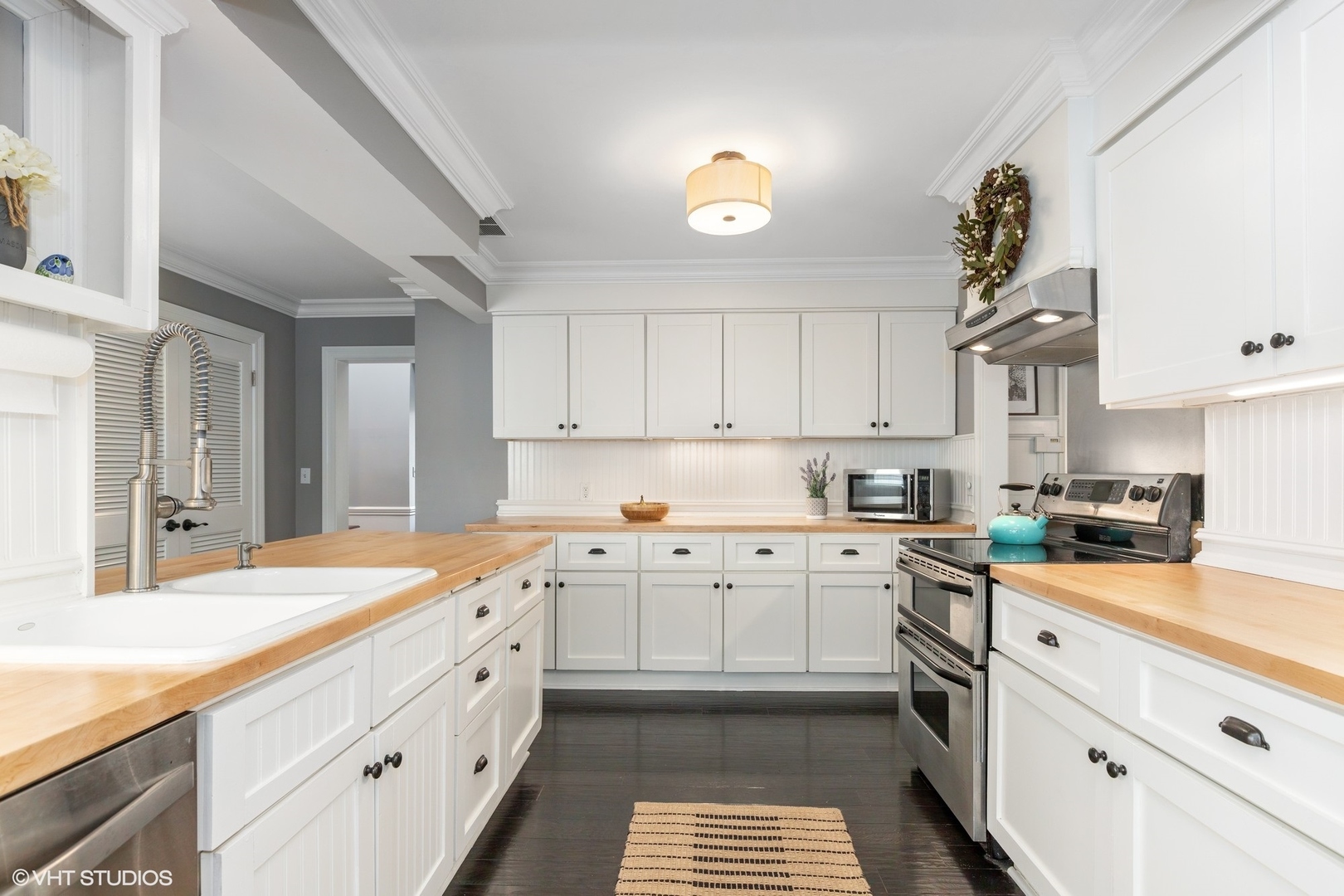 1414 North Avenue Bannockburn, IL 60015 - Photo 8 of 29 a kitchen with granite countertop white cabinets and white appliances