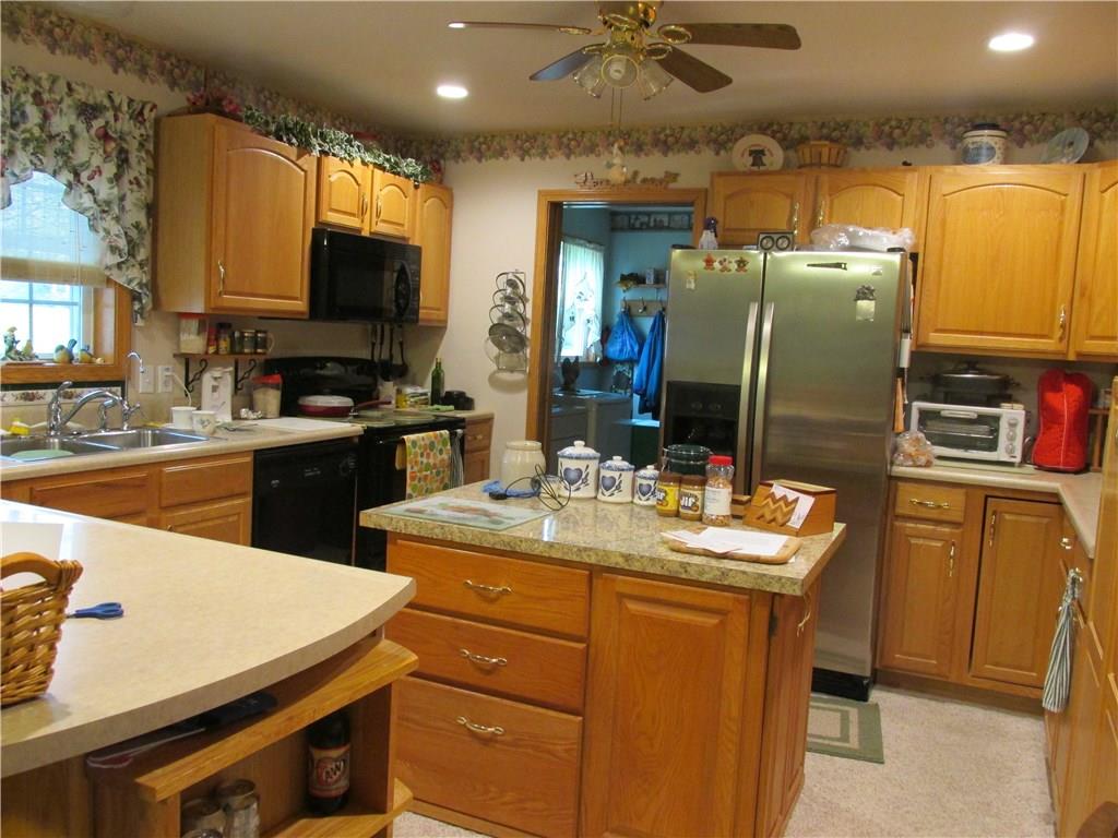 665 Greenfield Road Mercer, PA 16137 - Photo 3 of 6 Kitchen has tons of storage with center island for meal preparation. Appliance package included.