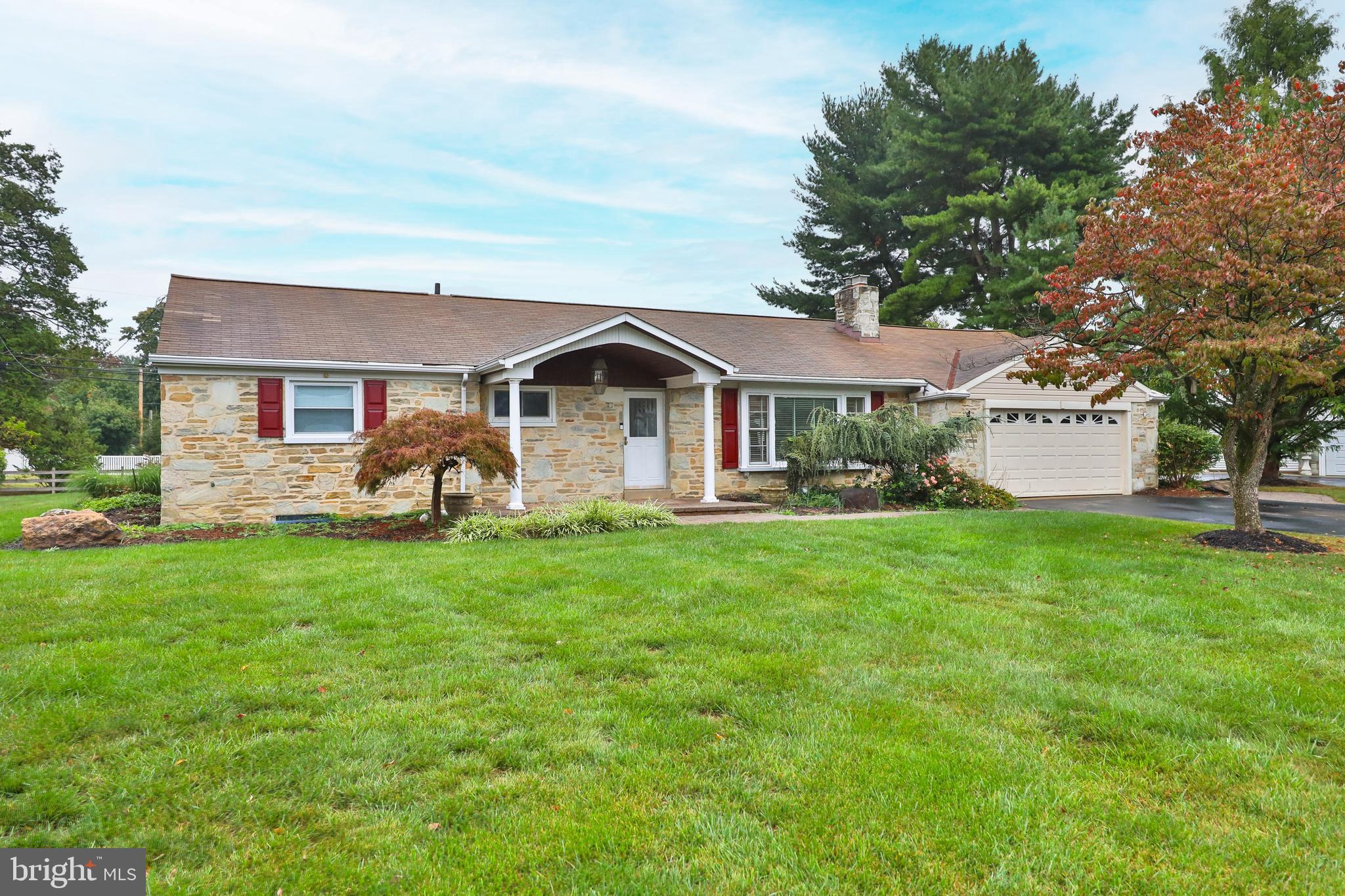 95 Radburn Road Huntingdon Valley, PA 19006 - Photo 1 of 40 a front view of a house with a garden