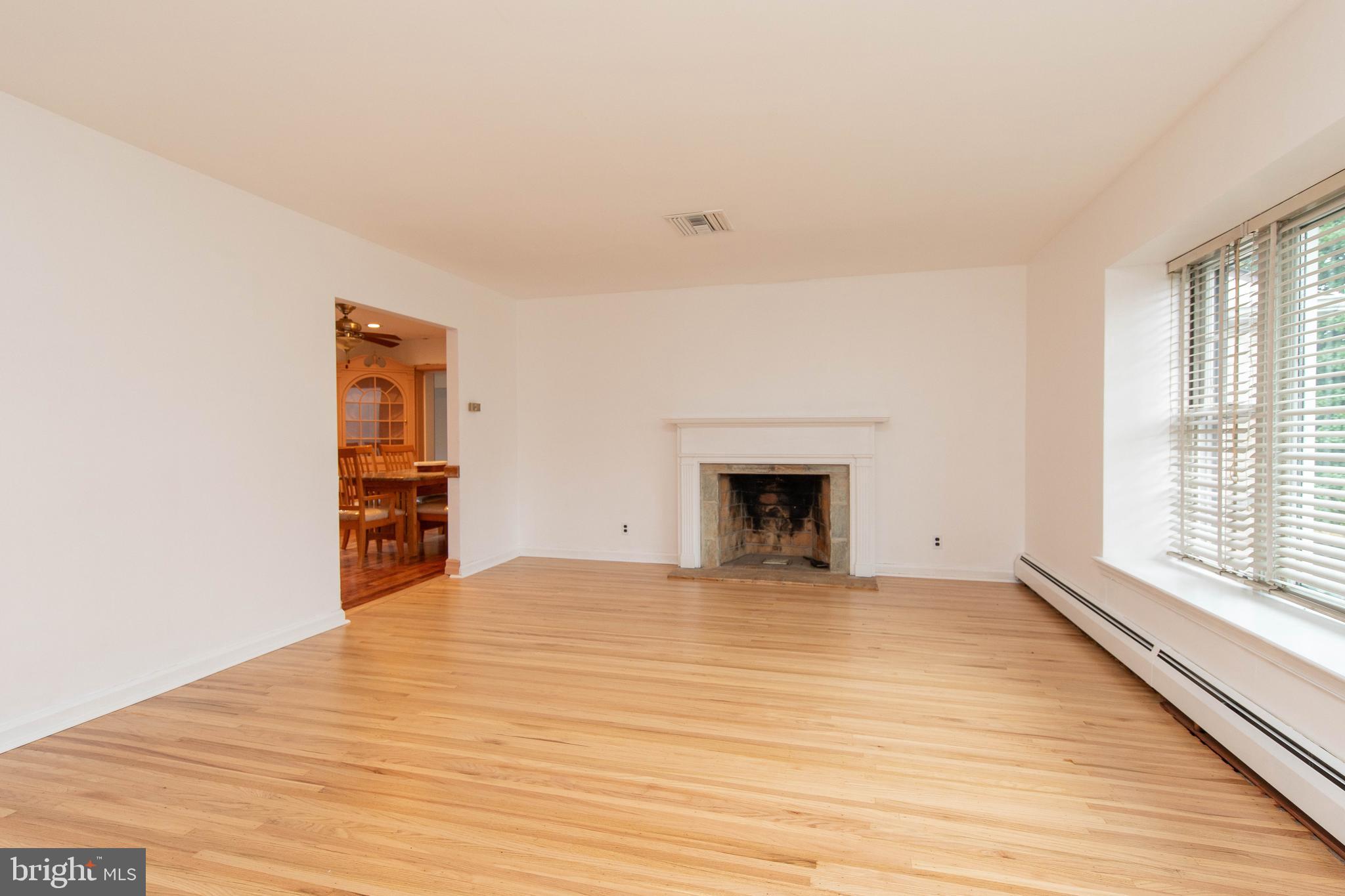 95 Radburn Road Huntingdon Valley, PA 19006 - Photo 13 of 40 a view of empty room with wooden floor and fan